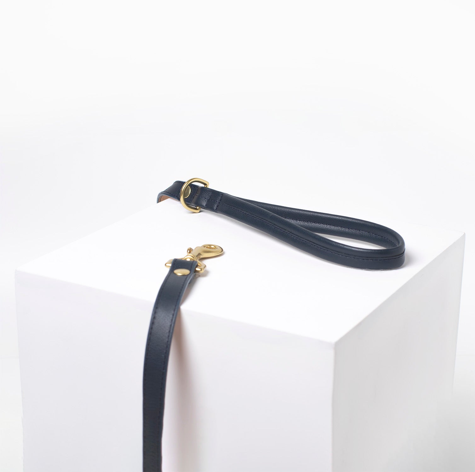 Navy blue leather dog leash with brass hardware