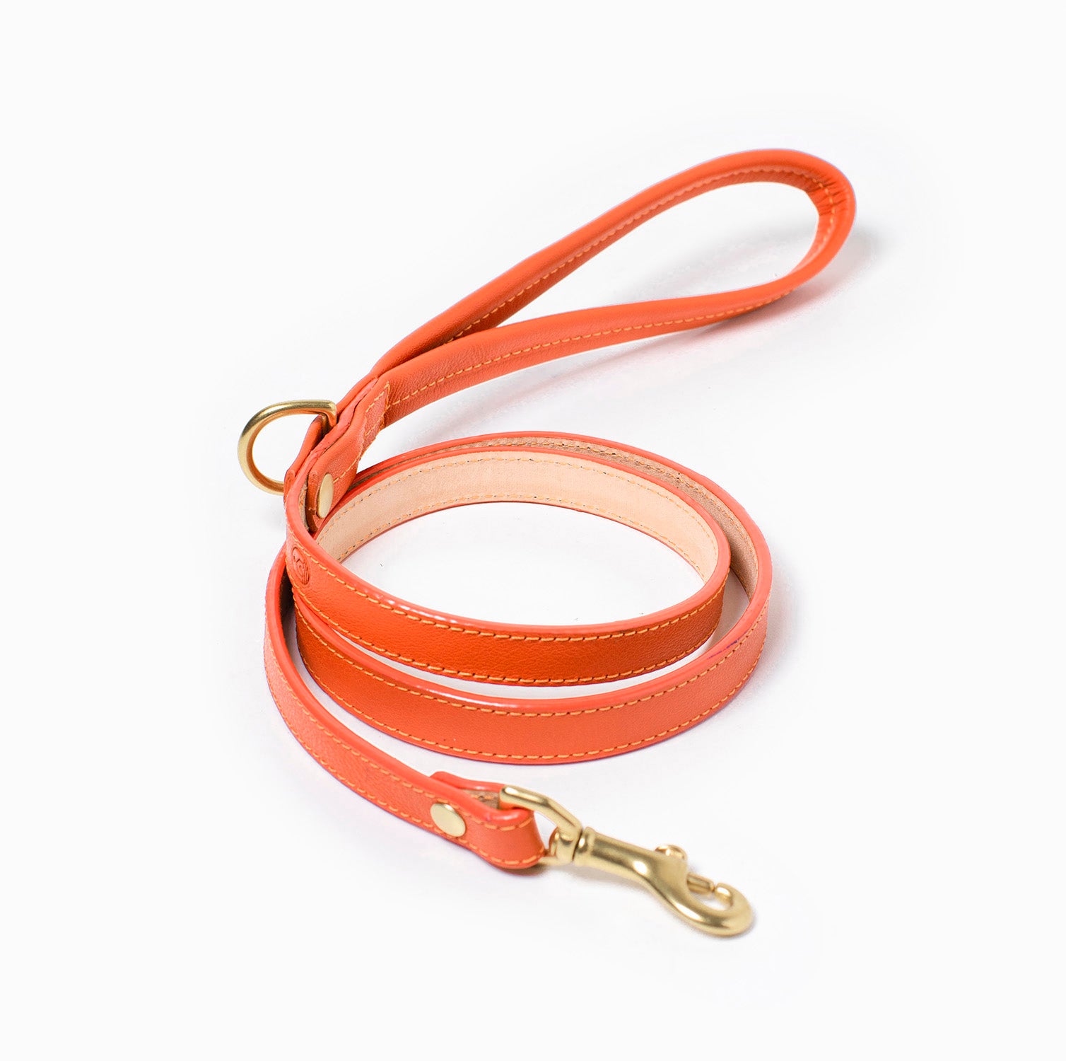Orange leather dog leash with brass hardware