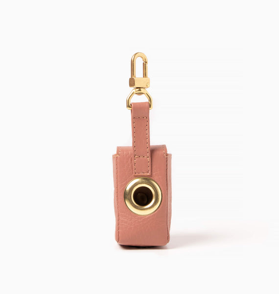 Nude pink leather bag holder with with brass hardware. Poop bag holder.